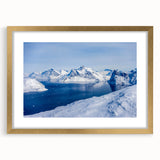 Abstract art print of a Greenland landscape in muted green and blue tones, framed in gold.