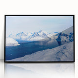 Large abstract wall art depicting a Greenlandic landscape in muted green and blue tones, framed in black acrylic.