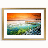 Abstract art print of a European scenery in muted green and blue tones, framed in gold, suitable for dining room decor.