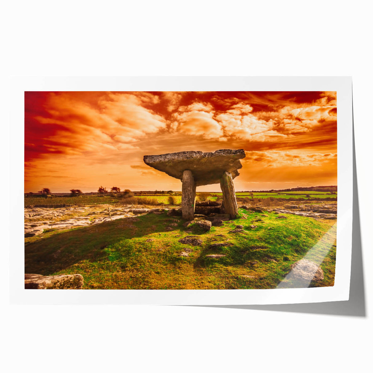 Rolled print of an Irish landscape featuring green fields and a distant castle, in muted earth tones.