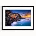 Colorful art of Cinque Terre with abstract prints in vibrant hues on a large framed canvas, ideal for living room decor.