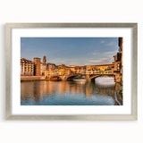 Extra large abstract art print of Florence scenery in muted earth tones on textured canvas, framed in silver.