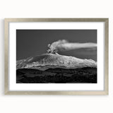 Extra large abstract art print of Mount Etna in textured hues of gray and silver, framed with a mat in a silver frame.