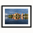 Abstract art print of a European scenery in vibrant colors on a textured, extra large canvas, framed in black.