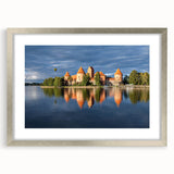 Extra large abstract art print of a European scenery in muted earth tones on a silver-framed canvas.