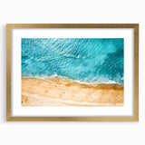 Abstract art print of the Mediterranean Sea in muted blue and white tones, framed in gold, ideal for dining room decor.