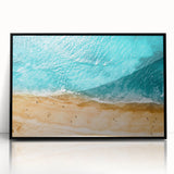 Large abstract wall art depicting the Mediterranean Sea in muted blue and green tones, framed in black acrylic.