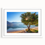 Textured art featuring an abstract depiction of a Montenegro landscape in muted earth tones on a framed white mat.