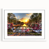 Textured art of Amsterdam's canal scene in muted earth tones on a framed white mat, ideal for bedroom wall decor.