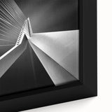 Black wall art featuring a textured, colorful abstract of a European scenery on a large framed canvas.