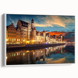 Vintage poster art of a scenic European landscape in vibrant colors on a large framed canvas, suitable for living room decor.