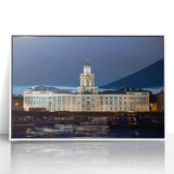 Mid-century modernist art depicting a European cityscape in muted gray tones on a framed acrylic print.