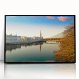 Large abstract wall art depicting a serene Scottish landscape in muted green and blue tones, framed in black acrylic.