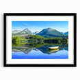 Colorful abstract art print of a European scenery in a large black frame, ideal for living room decor.