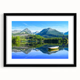 Colorful abstract art print of a European scenery in a large black frame, ideal for living room decor.