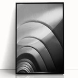 Large abstract wall art depicting a stylized Barcelona cityscape in muted gray tones on a framed acrylic.