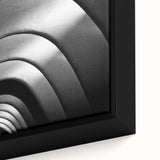 Extra large framed canvas of a textured Barcelona cityscape in black with vibrant color accents, ideal for living room decor.