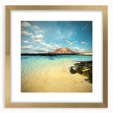 Abstract art print of a European scenery in muted gold and beige tones, framed with a gold mat.