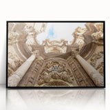 Large abstract wall art depicting a dynamic Valencia cityscape in muted grey and orange tones on a black framed acrylic…