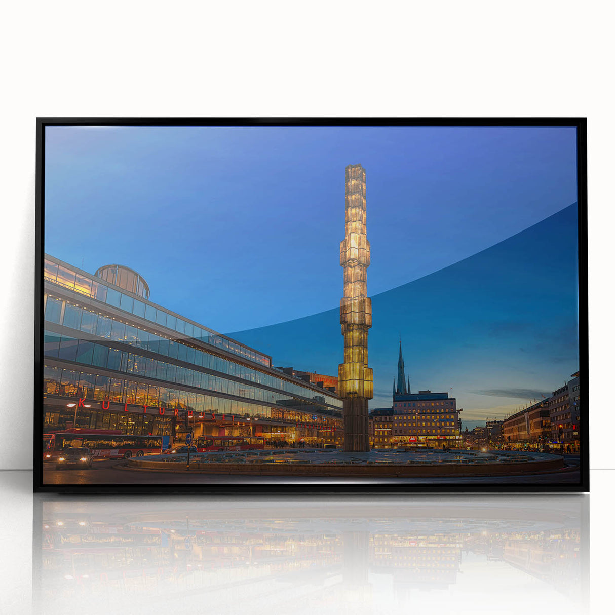 Large abstract wall art featuring a stylized Stockholm scenery in muted gray and blue, framed in black acrylic.