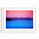 Abstract art print of Geneva scenery in muted blue and green tones on a framed white mat, suitable for dining room decor.