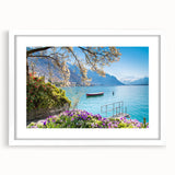 Abstract art print of a Swiss landscape in muted green and blue tones on a framed white mat, suitable for dining room decor.