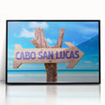 Large abstract wall art depicting the Cabo San Lucas coastline in muted blues and grays, framed in black acrylic.