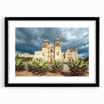 Abstract art print of Oaxaca scenery in vibrant colors on a textured, extra large canvas, framed in black.