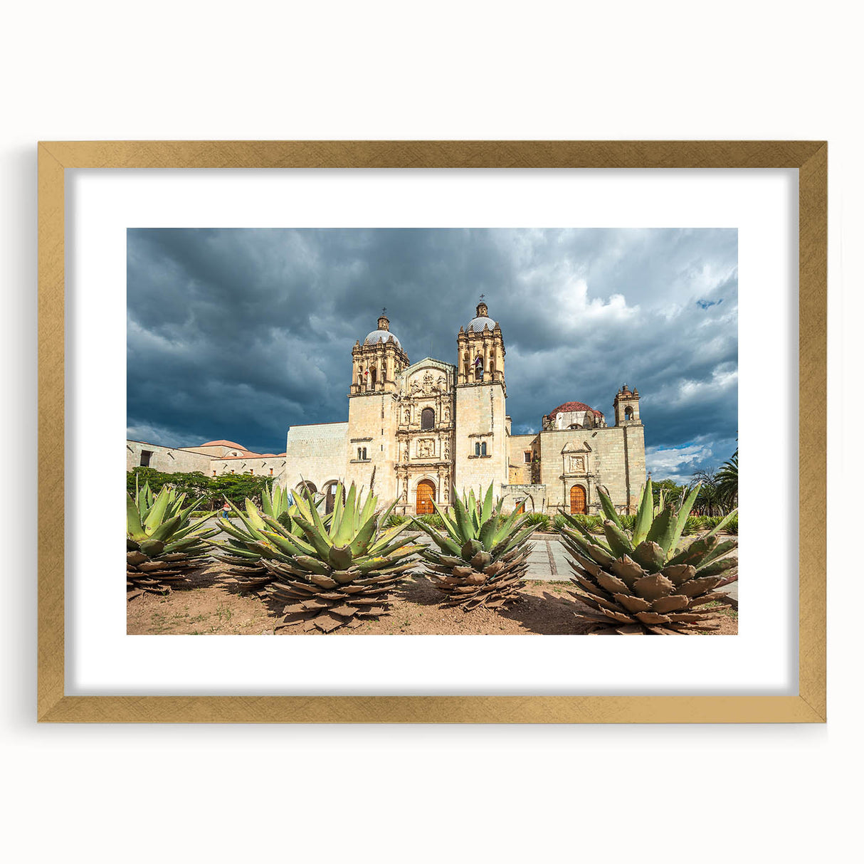 Extra large abstract art print featuring textured scenery of Oaxaca in muted earth tones, framed in gold.