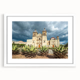 Abstract art print of Oaxaca scenery in muted earth tones, framed with a white mat, suitable for dining room decor.