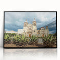 Large abstract wall art of Oaxaca scenery in muted earth tones, framed in black acrylic.