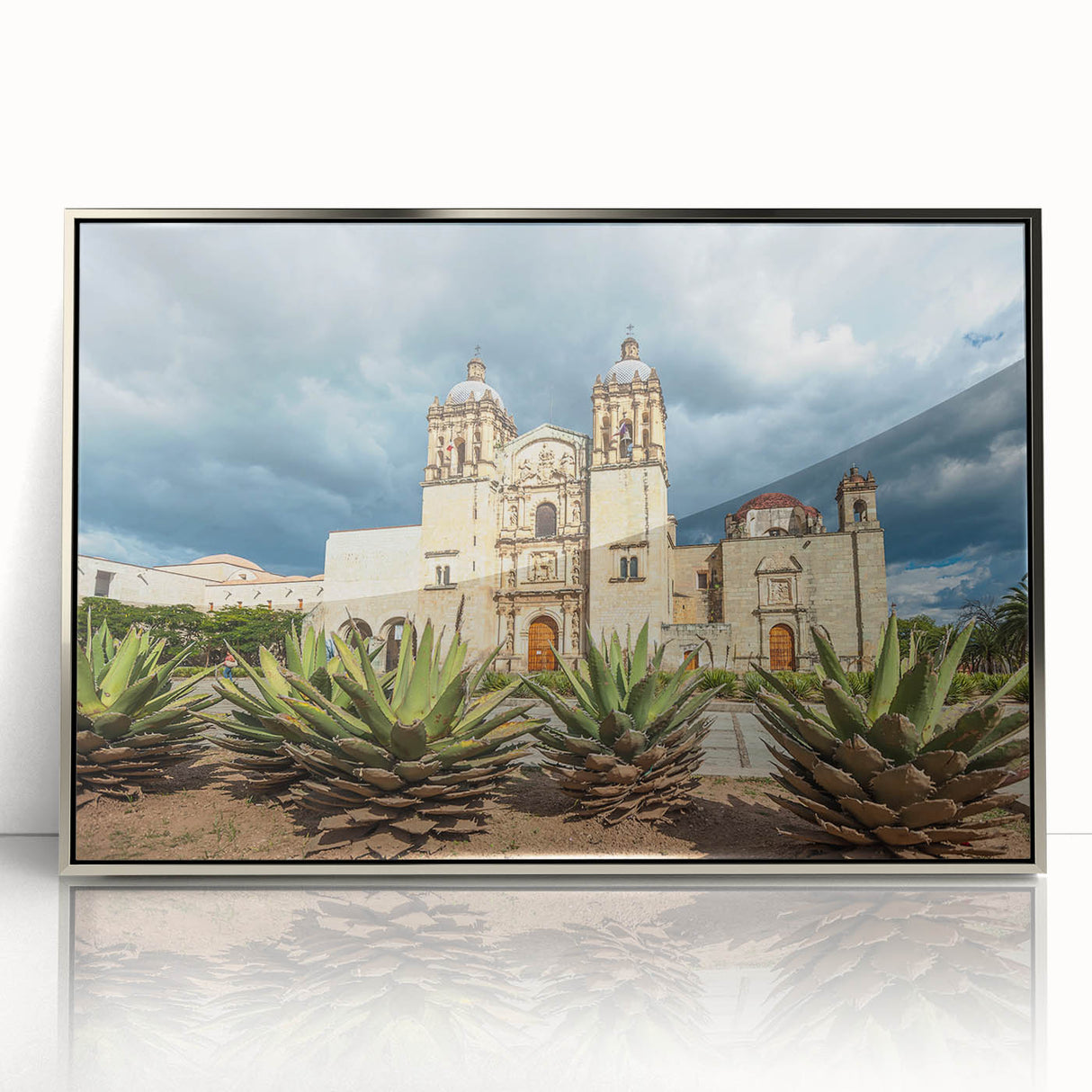 Mid-century modernist art depicting a scenic Oaxaca landscape in vibrant colors, framed in silver acrylic.