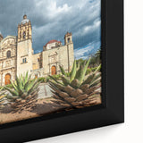 Extra large framed canvas of a black textured art depicting colorful Oaxaca scenery, ideal for living room decor.