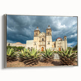 Framed canvas featuring a vintage-style landscape painting of Oaxaca, Mexico, with vibrant colors against a black background.