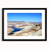 Abstract art print featuring a colorful, textured depiction of a Middle Eastern landscape on a large framed canvas.
