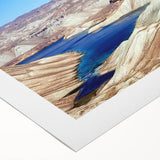 Art deco poster of a Middle Eastern landscape on rolled canvas, featuring earthy and muted tones.