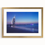 Extra large abstract art print of Dubai skyline in gold frame, featuring textured details and muted earth tones.