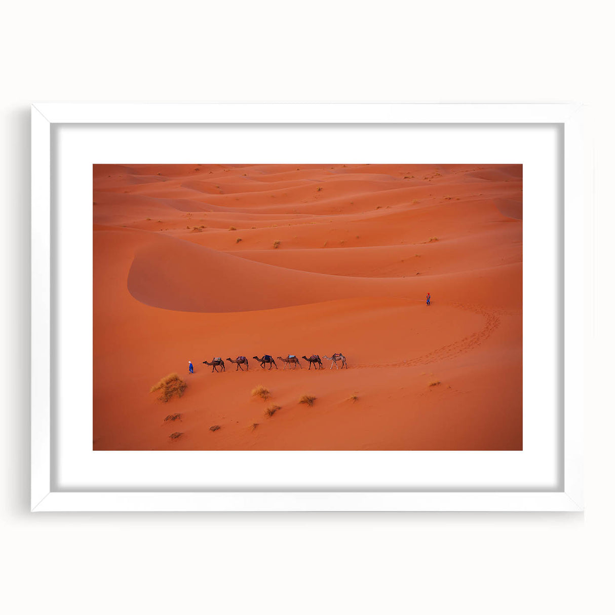 Abstract art print depicting a Middle Eastern landscape in muted earth tones on a framed white canvas.