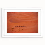 Abstract art print depicting a Middle Eastern landscape in muted earth tones on a framed white canvas.