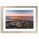Textured art print of the Dead Sea in muted blue and beige tones, framed in silver, suitable for bedroom art.