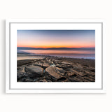 Abstract art print depicting the Dead Sea in muted blue and gray tones, framed with a white mat.