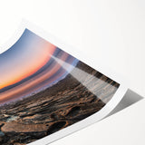 Extra large wall art featuring a line art design of flowers in muted earth tones on a rolled canvas.