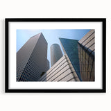 Extra large, colorful abstract art print of Tel Aviv skyline in vibrant hues on textured canvas, framed in black.