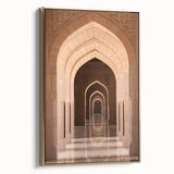 Framed canvas depicting a vintage-style landscape of Middle Eastern scenery in muted gold and black.