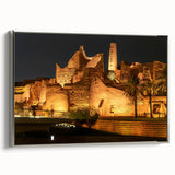 Framed canvas featuring a vintage-style landscape painting of a Saudi Arabian scene in muted earth tones.