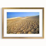 Extra large abstract art print depicting a Middle Eastern scenery in textured gold tones, framed with mat.