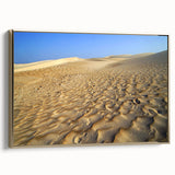 Framed canvas featuring a vintage-style landscape painting of a Middle Eastern village, with muted earth tones.