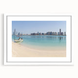 Abstract art print of Abu Dhabi skyline in muted gray and blue tones on a framed poster.