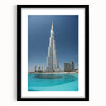 Colorful abstract art print of Burj Khalifa, featuring vibrant blue and orange tones on a large framed canvas.