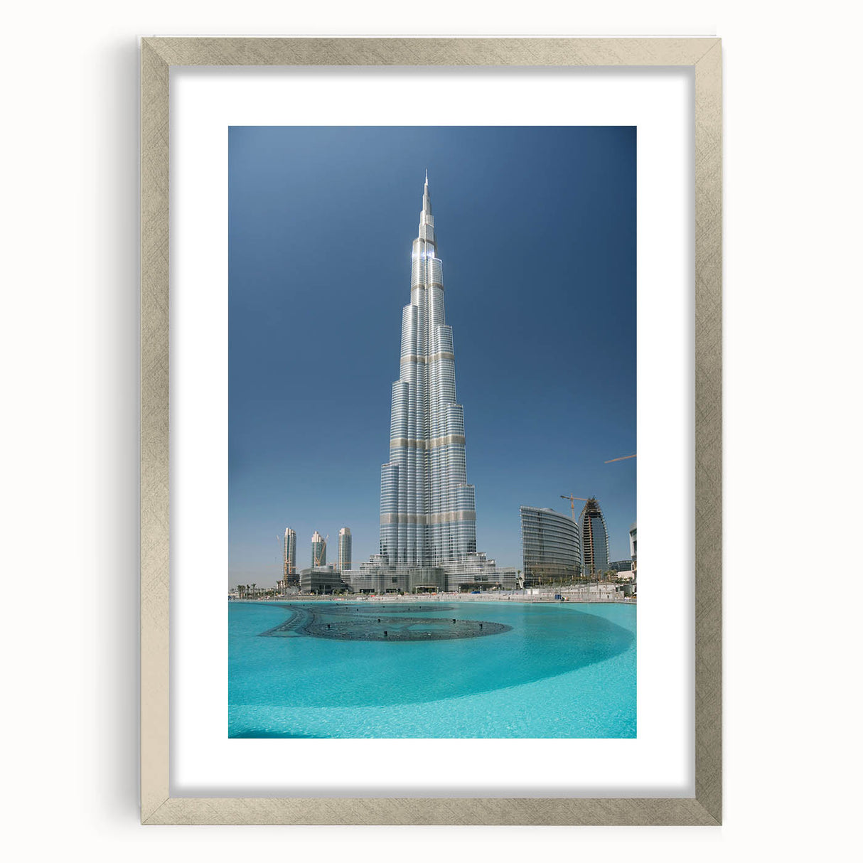 Textured art print of the Burj Khalifa in abstract style with muted gray and silver tones, framed in silver.